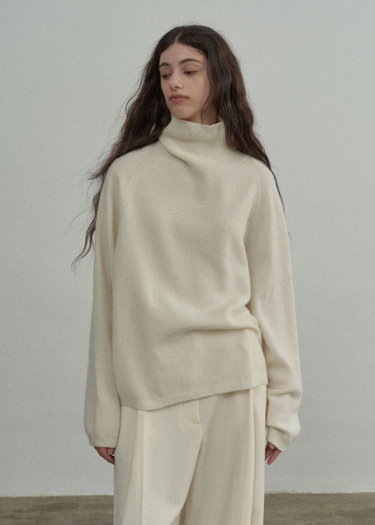 Wool Roll Neck Jumper in Cream