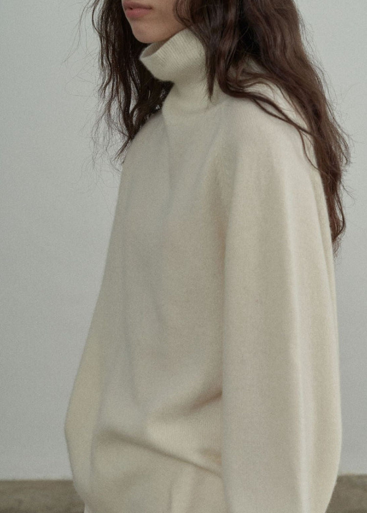 Wool Roll Neck Jumper in Cream