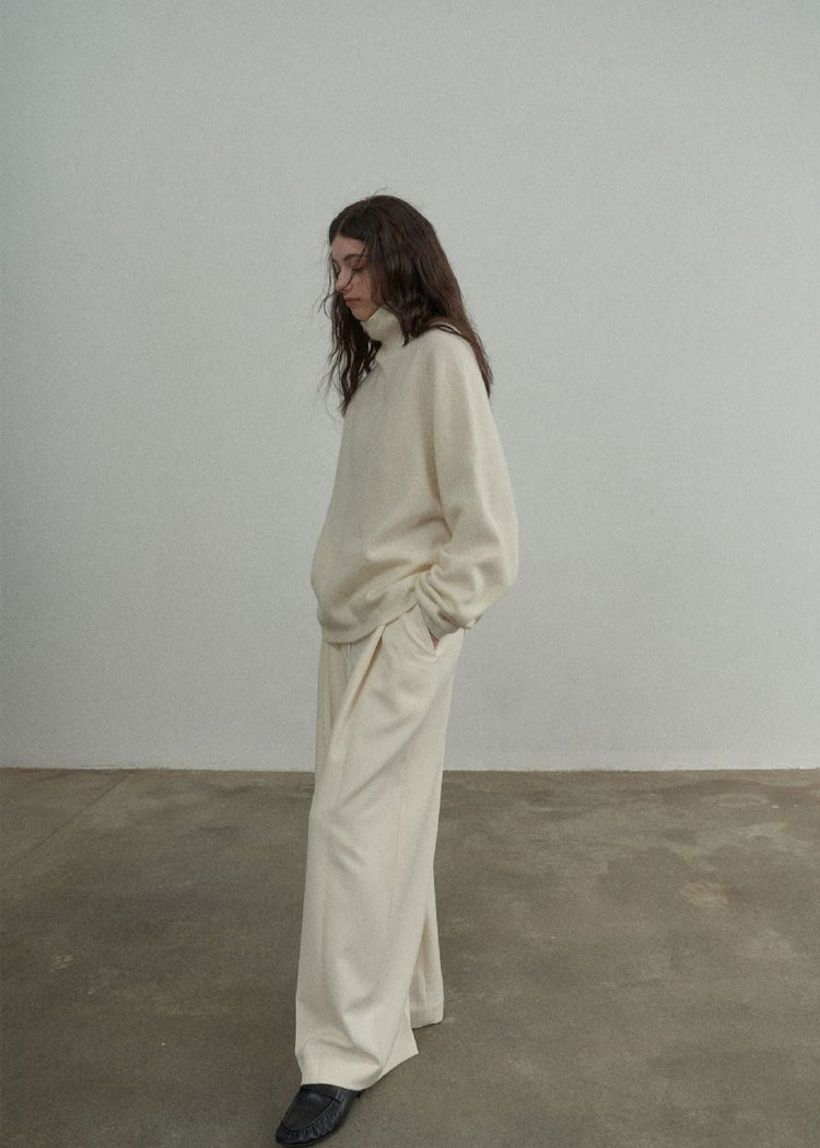 Wool Roll Neck Jumper in Cream