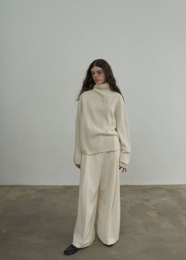 Wool Roll Neck Jumper in Cream