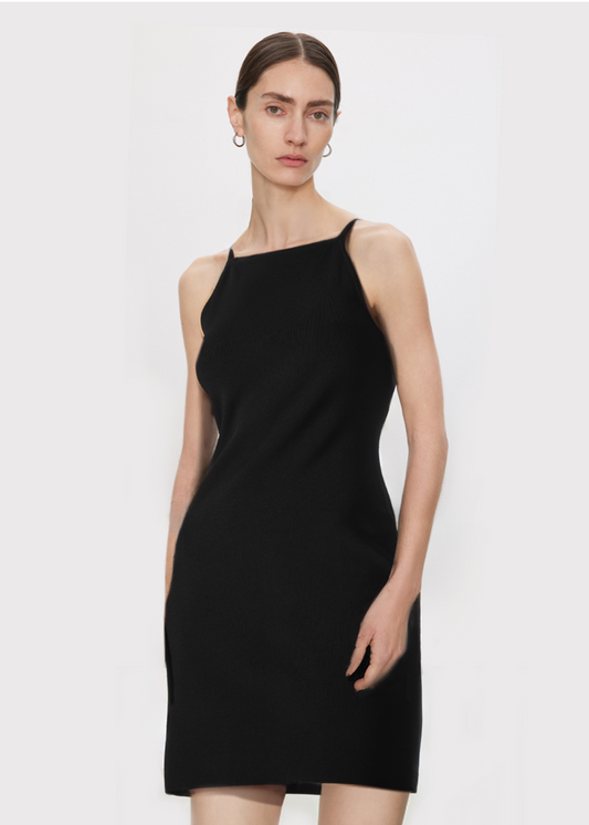 Woman wearing a black dress on a white background
