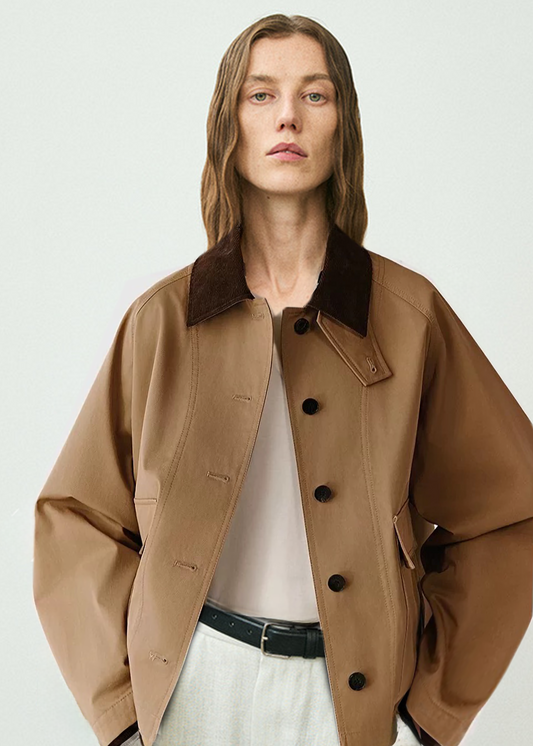 Person wearing a brown jacket with a white background